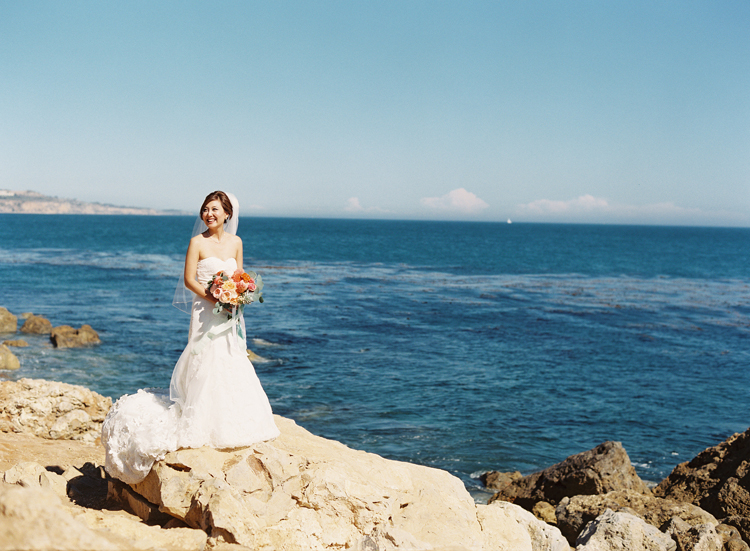 coral beach wedding photo by caroline tran