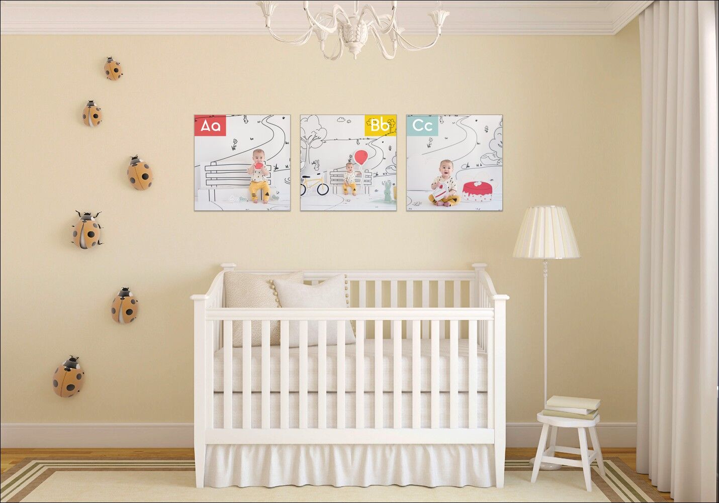 Photo of nursery with white crib and three ABCsons posters above the crib.  