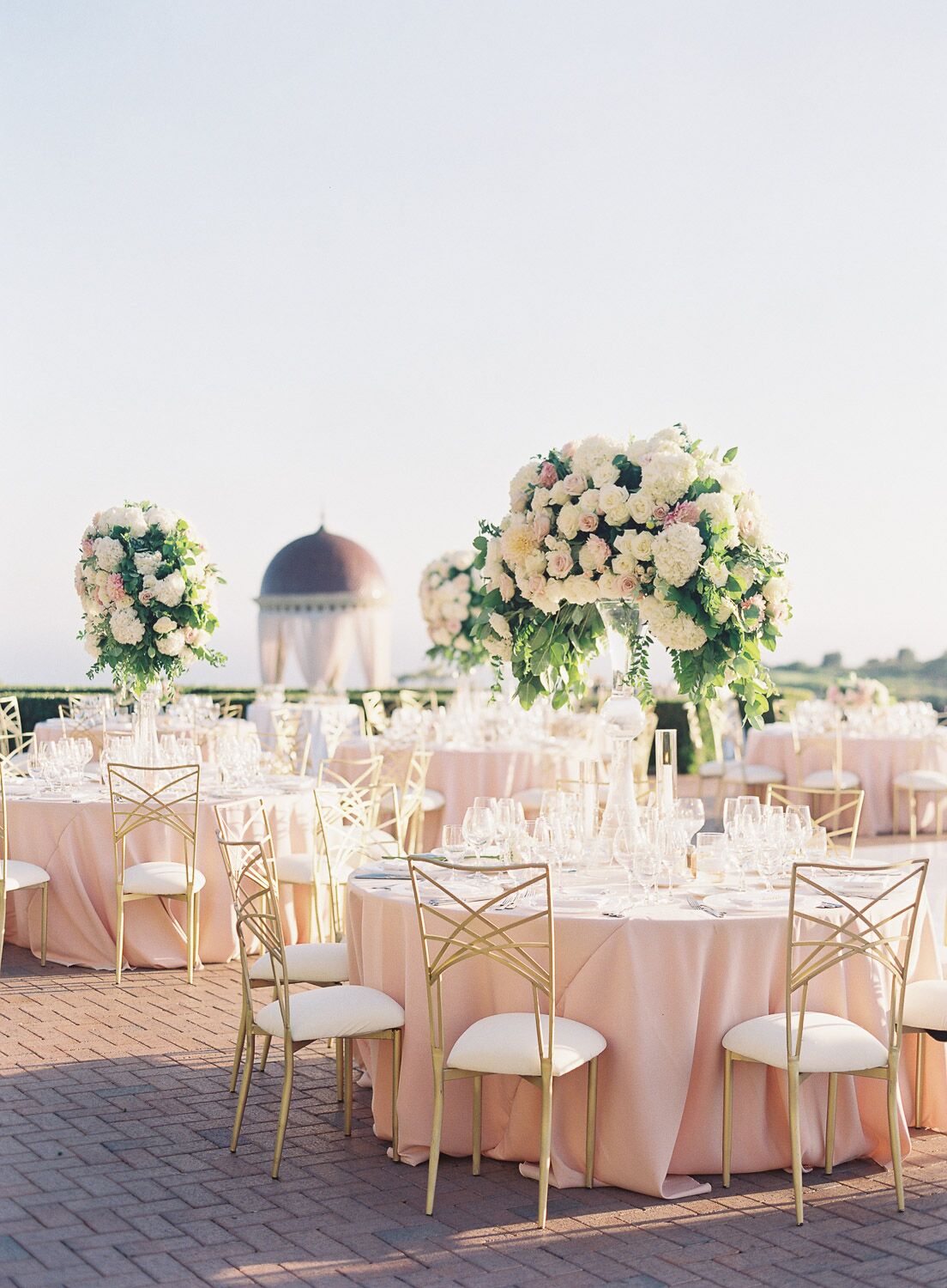 Outdoor wedding reception with round tablesettings