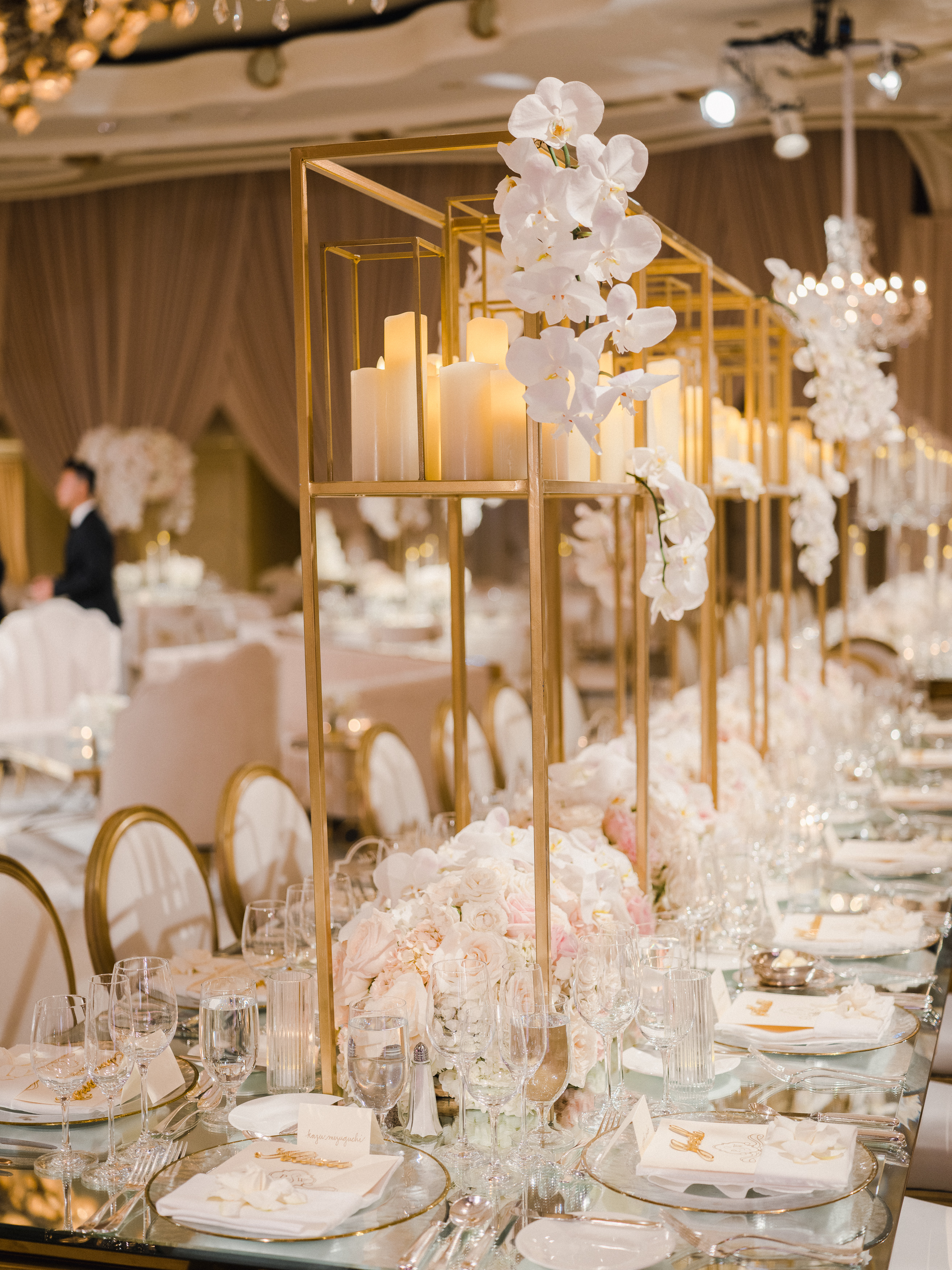 Image of long table setting with cascading orchids and candles