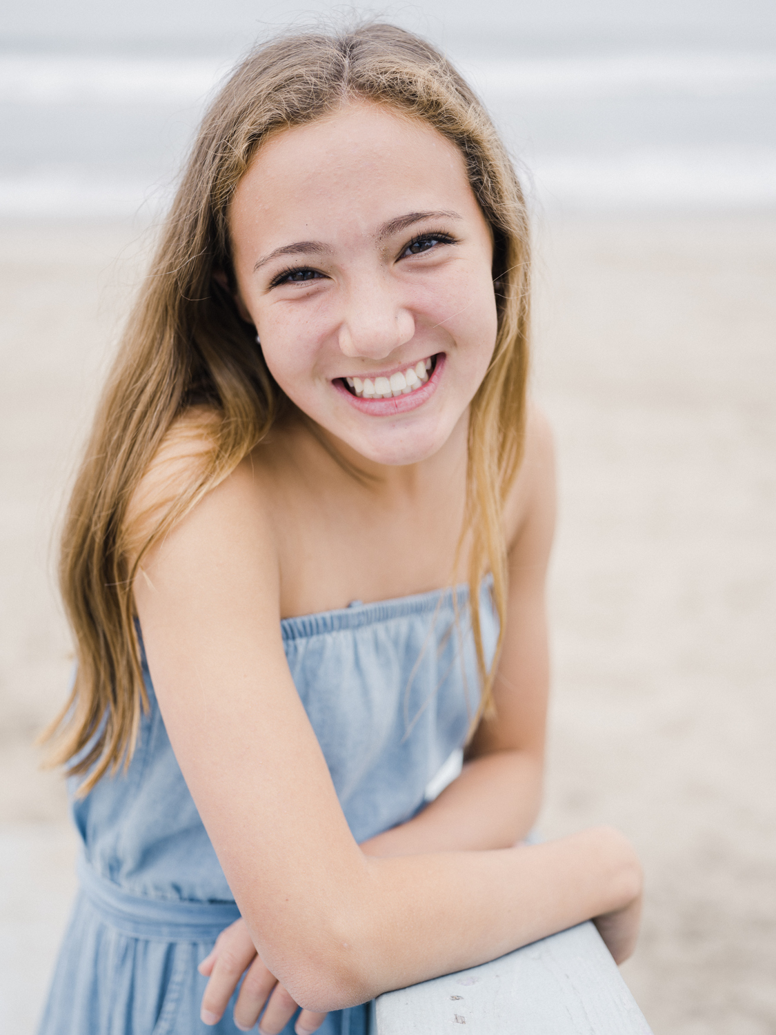 Girl looking into camera on the beach