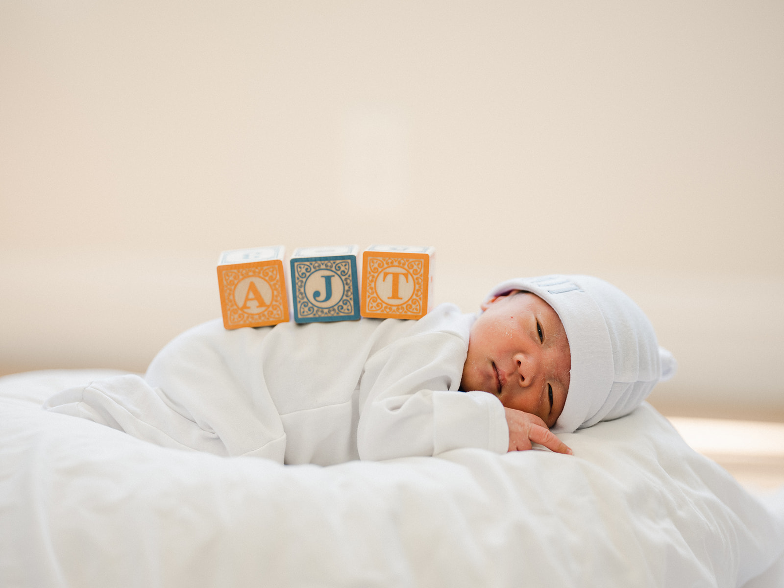 Bundled in their cute white outfits, the boys were sleepy and peaceful throughout the photoshoot. #newborn #photography