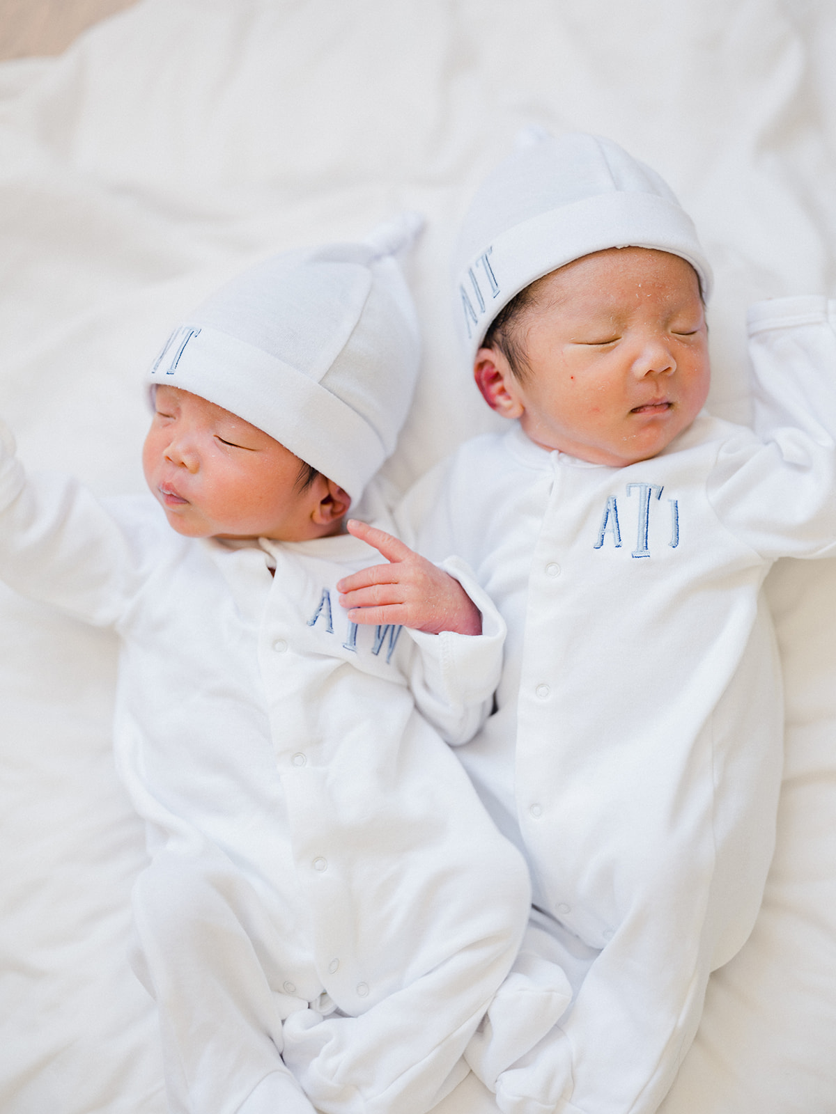 Bundled in their cute white outfits, the boys were sleepy and peaceful throughout the photoshoot. #newborn #photography